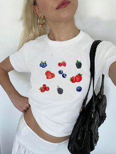 Berries Baby Tee, Fruit Pinterest Aesthetic, Cute Graphic tee, Y2K Shirt, Womens Summer Baby Tee, Fruit Shirt, Gen Z Trending *IMPORTANT PLEASE READ BEFORE PURCHASING* My store uses DTG (Direct to Garment) printing. This means the design is printed into the garment. This means it is designed to last longer than other printing processes. Due to this printing process the design colors may not be as vibrant as shown in the photos. There may at times be a slight difference between real and perceived Y2k Style Short Sleeve T-shirt With Fruit Print, Y2k Printed Crew Neck T-shirt, White Y2k Short Sleeve T-shirt, Y2k Style White Short Sleeve T-shirt, Y2k Style White T-shirt With Short Sleeves, White Short Sleeve Y2k T-shirt, Y2k Printed Short Sleeve Tops, White Printed Y2k Tops, Summer Basic Shirt With Graphic Print