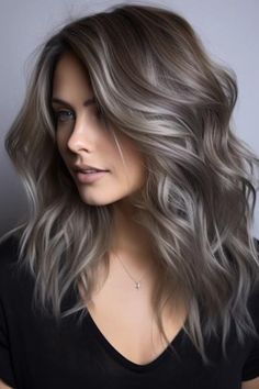 Dark blonde with charcoal grey highlights is a modern look and ideal for people looking to have a daring color. This dark blonde base with charcoal grey highlights introduces a special modernity into the entire look.  Click here to check out more best dark blonde hair color ideas to try this year. Charcoal And Silver Hair, Brunette With Ash Blonde Balayage, Dark Blonde Silver Hair, Icy Ash Brown Hair, Dark Grey Hair With Highlights, Dark Icy Blonde Hair, Dark Blonde Hair Ash, Iced Coffee Hair Color, Balayage Hair Grey Ash Blonde