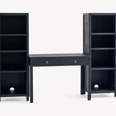 two black bookshelves and a desk with one drawer on each side, the other open