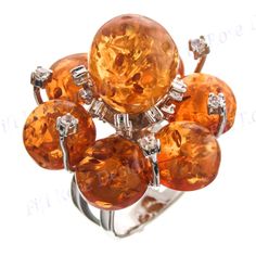 "Sparkling 925 Sterling Silver Simulated Amber Cz Cocktail Ring Width: 35mm(1 1/4\") 925 Sterling silver, Simulated amber, Cubic Zirconia Price: 74.95" Orange Cubic Zirconia Jewelry For Anniversary, Elegant Amber Crystal Ring, Amber Jewelry With Prong Setting For Anniversary, Baltic Amber Ring For Anniversary, Amber Topaz Jewelry, Amber Crystal Ring With Gemstone, Amber Crystal Gemstone Ring For Anniversary, Amber Crystal Round Ring, Orange Multi-stone Ring Jewelry