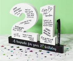 a black and white sign with writing on it that says happy birthday to the two year old