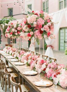 Elegant Garden Theme Wedding Reception Decor, White Drapery with Hanging Pink Flowers, Long Wooden Feasting Table with Wooden Cross Back Chairs, Tall Pink, Ivory and Red Floral Centerpiece, Lush Flowers Table Runner, Gold Chargers | St. Pete Wedding Venue The Vinoy Renaissance Pink Floral Centerpieces, Wedding Ceremony Flower Arrangements, Floral Peacock, Pink Wedding Theme, Backdrop Wedding, Themed Weddings, Wedding Ceremony Flowers, Wedding Vendor, Wedding Designer