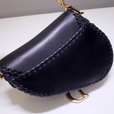 - 100% calfskin leather- Carried in the hand or on the shoulder- Short handle strap- Back pocket- Suede lining with 1 zip pocketSiz: 25.5 x 20 x 6.5 cm Dior Saddle, Saddle Bag, Dior Saddle Bag, Dior Bag, Saddle Bags, Saddle, Luxury Bags, Calf Skin, Fashion Bags