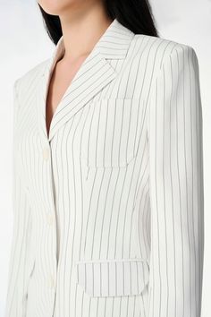 This blazer is perfect for creating a basic, yet chic look. It's straight form and long sleeves make it the ideal piece for most occasions, allowing you to dress it up or down at a moment's notice. Dress sharp and be confident in your look - no matter what the occasion. Elegant Spring Blazer With Concealed Placket, Spring Suits With Concealed Placket And Long Sleeve, Elegant Spring Blazer With Welt Pockets, Elegant Long Sleeve Blazer With Welt Pockets, Chic Long Sleeve Suits With Concealed Placket, Chic Long-sleeve Suits With Welt Pockets, Timeless Long Sleeve Suits For Spring, Spring Long Sleeve Blazer With Concealed Placket, Timeless Long Sleeve Spring Blazer