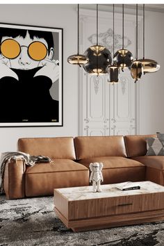 a living room with a couch, coffee table and chandelier