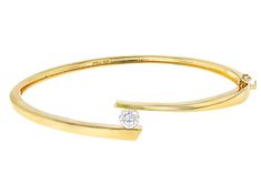 Pre-Owned Moissanite Fire® .60ct diamond equivalent weight round, 14k yellow gold over sterling silver bangle bracelet. Measures  approximately 7 & 1/4" L x 7/16" W. and has a  box clasp. Actual moissanite weight is .54ct. .  This product may be a customer return, vendor sample, or on-air display and is not in its originally manufactured condition.  It may not be new.  In some instances, these items are repackaged by JTV. Formal Diamond Bangle With Single Diamond, Formal Bangle With Single Diamond, Fine Jewelry Bangle With Single Diamond, Modern Yellow Gold Round Diamond Bracelet, Yellow Gold Bangle With Single Diamond, Formal Fine Jewelry Bangle With Single Diamond, 14k Gold Bracelet With Prong Setting, Single Diamond Round Bracelet For Anniversary, 14k Gold Bracelet With Single Diamond