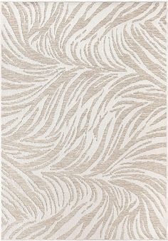 a beige and white rug with wavy lines on it