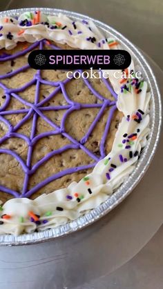 a spider web cookie cake with sprinkles on it