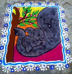 an elephant and her baby are depicted in this colorful rangolite art work on the ground