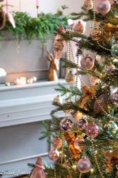 a christmas tree with ornaments hanging from it