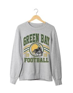 Jerzees Nu Blend Crewneck Sweatshirt in Oxford color with Green Bay Packer Design Crew Neck T-shirt For Game Day In Fall, Winter Game Day Long Sleeve Tops, Winter Long Sleeve Tops For Game Day, Long Sleeve Graphic Sweatshirt For Football Season, Fall Fan Apparel Long Sleeve Tops, Green Winter T-shirt, Long Sleeve T-shirt For Football Season, Fan Apparel Graphic Print Sweater For Fall, Crew Neck Tops For Game Day In Winter