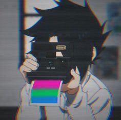 a person holding up a polaroid camera in front of their face with the image of an anime character on it