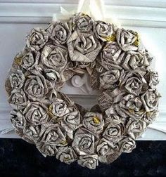 a wreath made out of newspaper is hanging on the wall