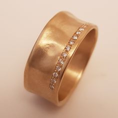 Thick unisex wedding band rough texture - simple wide wedding ring Product description: Metal 18k solid gold weight 7 grams Width 9mm Thickness 1.3 mm Half of the ring set with 18 small diamonds[as in the photos]. Total diamonds weight-0.1carat High quality-FVS Exellent cut You can also get this ring : You can get this ring also in 14k gold You can get this ring is Rose Pink and white gold You can get this ring engraved Please send me a convo, and I will send you PO for the customization SKU RMG Modern Thick Band Diamond Ring For Weddings, Modern Wide Band Wedding Ring, Thick Band Wedding Ring With Tension Setting, Modern Wide Band Ring With Brilliant Cut For Wedding, Wedding Ring With Tension Setting And Thick Band, Wedding Ring With Tension Setting And Wide Band, Modern Wide Band Diamond Ring For Wedding, Modern Brilliant Cut Wide Band Wedding Ring, Diamond Wide Band Ring With Tension Setting For Wedding