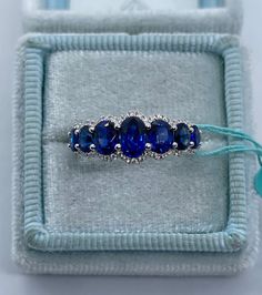 a ring with three blue stones in it