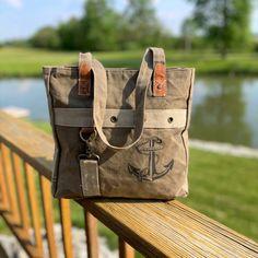 Navy, Nautical, Faith, Hope, Happiness and Strength...The anchor symbolizes so many things! Our Anchor Tote works as a small tote or shoulder bag and is lightweight, durable and strong. Constructed of repurposed Military Canvas and made to last. Details here --> https://bit.ly/AnchorToteBag Our entire selection here --> www.RecycledMilitaryBags.com Eco-friendly Canvas Satchel Bag, Vintage Upcycled Canvas Travel Bag, Eco-friendly Canvas Bag For Outdoor, Eco-friendly Upcycled Canvas Bag, Upcycled Canvas Tote Bag For Travel, Travel Canvas Bag In Sail Color, Casual Canvas Bags With Upcycled Details, Sail Canvas Travel Bag, Vintage Upcycled Canvas Bag