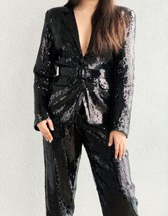 Stand out in this classic sequin blazer at all events!!!Fabric used is sequin and it is lined with a soft lining so it's very comfortable to the skinJacket length is 27cm and trouser length is 45cm Model is 5'9 and is wearing a US Size 4Care instruction - Dryclean or handwash. No need to iron Color - Black The blazer is a boyfriend jacket with shoulder pads and is loosely fitted and the trouser is a high waist pant fitted at the waist and loose from the thighs down 60s Suit, Black Sequin Blazer, Blazer With Shoulder Pads, Summer Day Dresses, Boyfriend Jacket, Office Suit, Woman Suit, Elegant Jacket, Trouser Suit