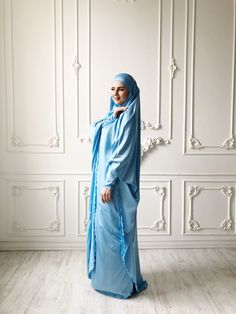 Tender light sky blue silk long khimar with high cuffs. This jilbab will be a good cover for you. Delicate fine silk ideal for summer weather. Always keep in mind that the fabric is enlightened, at the bottom have to be the dress. An elegant way for the believing women. Buttons secure the cuffs. Be sure when ordering in the note write the length of the khimar and the girth of the wrist.We can sew khimar in any other color! This handy headdress like those who do not yet know how to wind a scarf, Blue Long Sleeve Agbada For Eid, Blue Modest Khimar For Eid, Long Blue Khimar For Eid, Blue Long Khimar For Eid, Modest Abaya With Modesty Panel For Eid, Blue Modest Long Abaya, Blue Dabka Maxi Length Abaya, Modest Wedding Niqab For Eid, Modest Long Sleeve Blue Kaftan