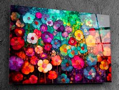 an abstract painting with colorful flowers on the side of a concrete wall, painted in bright colors