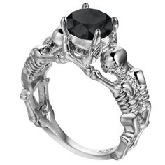 This ring is one of our popular skull rings for her! This beautifully crafted masterpiece ring features two skeletons holding a 3.0 ct round cut center stone set on prongs. This piece represents ‘together forever’ or ‘until death do us part’. Skull Rings for Her Features: Materials: High quality metal Platinum top layer, Cubic Zirconia stone This skull ring for her is featured in a blog post about skull jewellery fashion. Buy Womens skull rings Are Cheap Engagement Rings OK? Goth Biker, Skeleton Ring, Artisan Rings, Gothic Rings, Rock Chic, Rings Engagement, Ring Pendant Necklace, Unisex Ring, Skull Ring