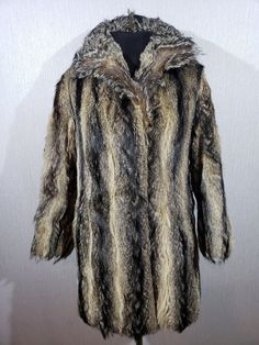 Warm black-brown women's fur coat with genuine fur. Reliable black and brown women's fur coat with genuine fur. The fur coat is made of genuine undyed fur. The fur coat fastens on metal hooks. The fur coat has two convenient pockets at the bottom. The fur coat has a pleasant lining. Wearing a fur coat is pleasant and comfortable. The coat will perfectly emphasize your sophistication and luxury. MEASUREMENTS Length                                              82 cm  |  32.5 in Pit to pit                                            52 cm  |  20.5 in Chest circumference                   104 cm  |  41 in                                                             Waist  circumference                    114 cm  |  45 in                                           Bottom circumference Long Faux Fur Mink Coat, Mink Colored Faux Fur Coat, Mink Colored Fur Coat With Faux Fur Trim, Mink Color Long Fur Coat With Faux Fur Lining, Brown Long Coat With Faux Fur Trim, Mink Coat, Womens Jackets, Fur Coats Women, Cool Jackets