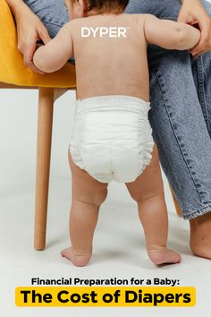 a baby in diapers sitting on a chair with his back to the camera and looking down