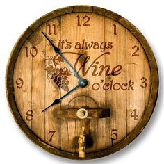 a wooden clock with writing on it and a wine cork in the middle is shown