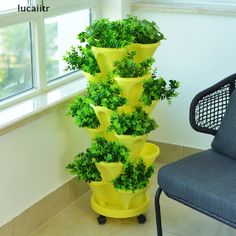 a tall yellow planter sitting next to a chair in a living room on top of a tile floor