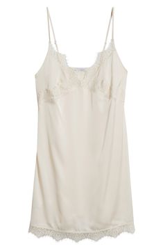 Feel your most glamorous through your morning and nighttime routines in this satin chemise trimmed in delicate lace. 25" center front (size medium) V-neck Adjustable straps 100% polyester Machine wash, dry flat Imported Satin V-neck Slip Dress With Contrast Lace, V-neck Satin Camisole With Lace Trim, Coquette Lace Trim Slip Dress For Night, Coquette Night Slip Dress With Lace Trim, Fitted Lace V-neck Chemise, Lace Sleepwear With Delicate Straps And V-neck, Delicate Lace Silk Nightgown For Sleep, Silk Nightgown With Delicate Lace For Sleep, V-neck Slip Dress For Bedtime