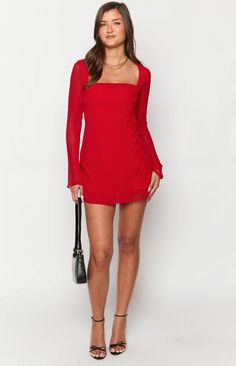 Red long sleeve mini dress

How to style:
Dress to impress in our Lucy red mini dress ()! Perfect for cocktails () or a night out with the girls. Pair with strappy heels and gold jewellery () to look effortlessly chic for your next event. 

Features:


  
 * Light weight material 
 * Long Sleeves 
 * Square neckline 
 * Wrap skirt with an adjustable tie on the left of the bodice 
 * Mini Length 
 * Sheer material 
 * Body lined, arms unlined 
 * Invisible zip on the back Red Full Sleeve Dress, Red Long Sleeve Mini Dress, Full Sleeves Dress, Prom Midi Dress, 60's Dress, Summer Playsuit, Red Long Sleeve, Strapless Tops, Sheer Material