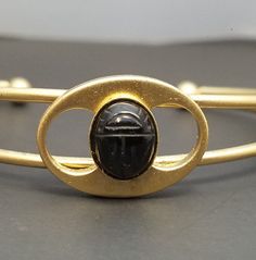 "Only $4 SHIPPING and additional items ship FREE (except doll furniture). Vintage BLACK ONYX SCARAB Cuff Bracelet Egyptian Revival Jewelry Genuine Stone Condition: NOS - New old stock -- jewelry made from vintage materials that were never sold at retail so it is it is \"new\" andunused Marked: No SIZE: Interior of cuff is 5 inches long with a 1 inch gap, Scarab is 10 x 8 mm UPS Ground Shipping is $11 for unlimited number of items.  This is best when you purchase multiple items and need a guarant Handmade Adjustable Black Bangle, Adjustable Black Handmade Bangle, Adjustable Handmade Black Bangle, Collectible Black Bracelet Jewelry, Vintage Black Metal Cuff Bracelet, Collectible Black Bangle Jewelry, Black Metal Cuff Bracelet As Gift, Black Metal Cuff Bracelet For Gift, Vintage Adjustable Black Bracelet