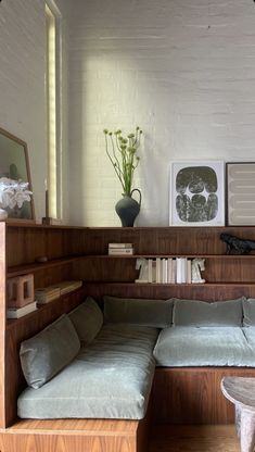 a living room filled with furniture and bookshelves