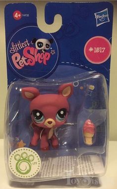 a littlest pet shop figure with an ice cream cone in its package on a table