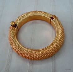 Vintage antique tribal old silver with gold vermeil gold gilded hollow gajre design Bracelet or bangle from Rajasthan India. worn by tribal people of Rajasthan. great design good for jewelry collection.Inner diameter side to side - 5.1 cm(2")Inner circumference - 16 cm (6.3")Outer diameter side to side - 7.1 cm(2.8")width max.. - 1.3 cm(0.5")weight - 30 gramsMaterial - silver gold plate on top. Heavy Antique Gold Bracelets, Vintage Gold Bracelets For Rituals, Heavy Gold Brass Bracelets, Heavy Gold Brass Bangle, Antique Gold Bracelets For Festivals, Vintage Gold Bangle For Festive Occasions, Antique Gold Bracelets For Rituals, Festive Vintage Gold Bangle, Selling Jewelry Online