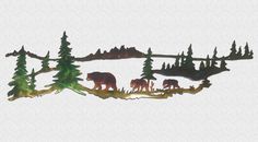 three bears are walking in the woods on a hill with trees and water behind them