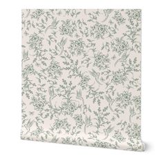 a white and green wallpaper with flowers on it