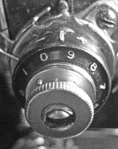 a black and white photo of a close up of an old fashioned camera with numbers on it