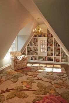 a room with a chair, bookshelf and rug in it