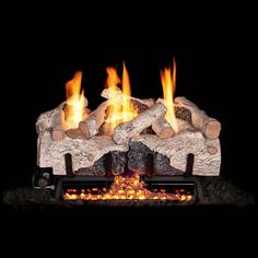 a fireplace with logs and flames in it