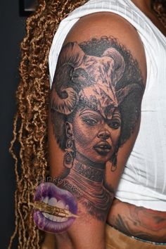 a woman with tattoos on her arm and chest