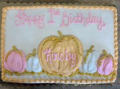 a birthday cake with frosting and decorations on it