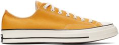 Low-top canvas sneakers in yellow. · Round rubber cap toe · Lace-up closure in white · Eyelet vents at inner side · Rubber sole featuring rubberized logo patch at heel Supplier color: Sunflower/Black/Egret Converse Sunflower, Converse Yellow, Converse Low Tops, Sport Shoes Men, Chuck 70, Outdoor Men, Converse Sneakers, White Eyelet, Vintage Casual