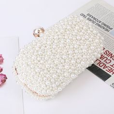 Meet our royal pearl clutch collection Unlimited handmade bead clutch evening pearl bag to finish off your outfit. Perfect as a bridesmaid bag, Soft and elegant you can give your bridesmaids the ultimate perfect pouch! Decoration: Pearl Lining Material: Polyester Pearl Clutch Bag, Satin Texture, Pearl Clutch, Clutch Bag Wedding, Buy Pearls, Lock Style, Wedding Clutch, Party Purse, Ladies Clutch