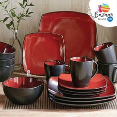 a red and black dinnerware set on a table