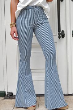 Elevate your style with our Mile High Pin Stripe Bell Bottoms! These dramatic pants feature a fitted thigh and extra wide bell bottom, creating a slender, tall look. Made with light stretch denim, these jeans offer a high rise fit for ultimate comfort. Perfect for both fall and spring seasons, these statement jeans are a must-have for any fashion-forward individual. Shop now and choose from over ten thousand chic styles! Statement Jeans, Black Faux Leather Leggings, Wardrobe Update, Pin Stripe, Ten Thousand, Mile High, Bell Bottom, Faux Leather Leggings, Family Outfits