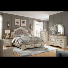 a bedroom scene with focus on the bed and dresser