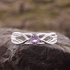 "Celtic style 925 sterling silver womens amethyst promise ring, Unique dainty & elegant promise ring for her, Celtic amethyst engagement ring WE OFFER UNLIMITED PERIOD INSTALLMENTS PLAN This is a beautiful, stunning, feminine ring that works well for all occasions, styles, and ages. You will love it! Ring information Stone: Amethyst Approximate size: 3.5mm Metal type: Silver Metal stamp: 925 Sterling SIlver Customization / Replacements It's easy to create jewelry that's perfect for you. Chan Elegant Amethyst Diamond Promise Ring, Amethyst Promise Ring With Accent Stones, Elegant Amethyst Birthstone Ring For Promise, Dainty Amethyst Jewelry In White Gold, Amethyst Birthstone Ring For Promise, Round Cut, Amethyst Promise Ring With Round Cut, Cubic Zirconia Amethyst Ring With Halo Setting For Promise, Elegant Amethyst Ring With Round Band For Promise, Elegant Amethyst Promise Ring With Round Band