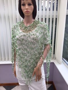 "This delicate look green and white wrap is a smart, unique wear for any lady, that comes in one, generous size , & would be ideal as a gift for anyone, or a get well soon wish, in fact, for any lady that likes a pretty green accessory! Why not shop with a UK seller, & support a small business today?  Approx size - from top to point, 64cm (25\") x 170cm (67\") across, at the widest point.  Polyester Hand wash- dry flat I have been established for several years, & have won awards for my scarves, as they are so versatile & easy to wear. The shawls evolved as a result of customer requests, & have proved to be equally as popular. I have also been interviewed on local radio" Elegant Handmade Shawl As Gift, Elegant Handmade Shawl For Gift, White Shawl For Spring, Handmade White Scarves For Spring, Handmade White Shawl For Spring, White Handmade Shawl For Spring, One-size White Shawl For Summer, Elegant One Size Wraps For Spring, White Shawl Scarves As Gift