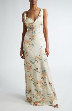 Artful construction that seemingly defies physics defines the beguilingly twisted bodice of this maxi cut from floral-print satin in a fitted-to-flowing design. 58 1/2" length (size 4US/36EU) Hidden back-zip closure Cowled deep V-neck Sleeveless Partially lined 100% viscose Dry clean Made in Portugal Designer Clothing Fitted Satin Maxi Dress With Floral Print, Spring Pre-draped Bias Cut Maxi Dress, Fitted Silk Maxi Dress Feminine Style, Spring Silk Maxi Dress With Bias Cut, Feminine Silk Maxi Dress With Floral Print, Floral Print Silk Maxi Dress, Satin Maxi Dress For Garden Party, Floor-length Floral Silk Maxi Dress, Fitted Silk Maxi Dress With Ruched Bodice