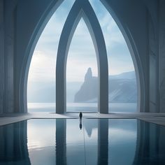 a person standing in the middle of a pool surrounded by arches